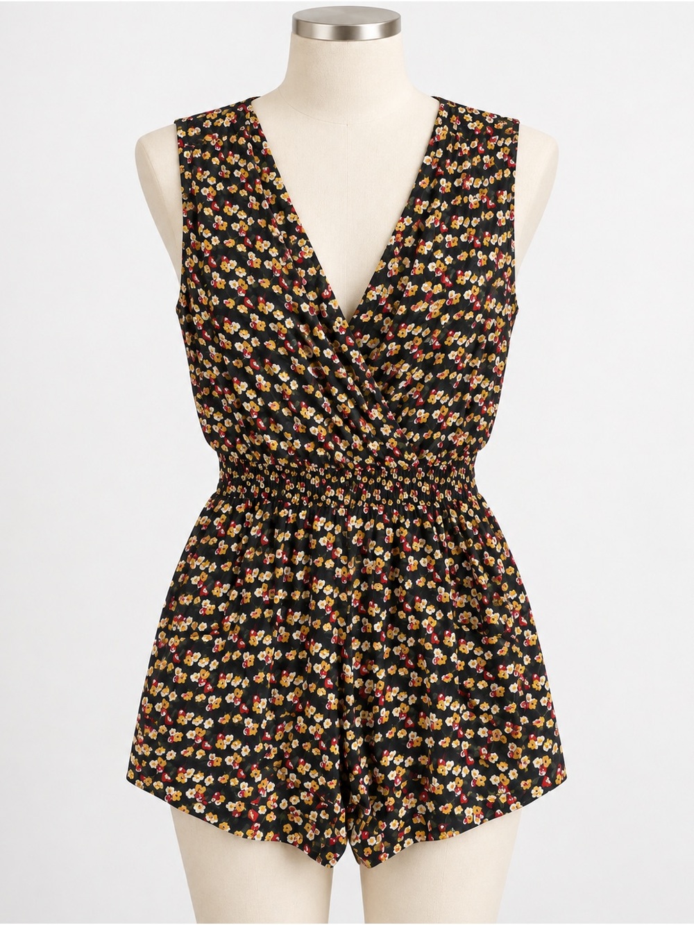 Costa Blanca Black Floral V-Neck Sleeveless Romper with Yellow & Red Accents
